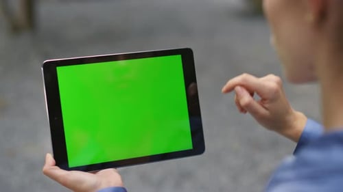 Hand Using Green Tablet Outdoors Closeup Girl Finger Swiping Chroma Key Pad