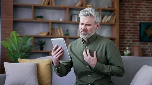 Man with Ailments Consults Doctor via Tablet