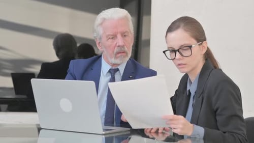 Man and Woman Working Together in Office