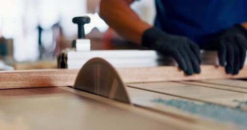 Wood Worker Cutting Wood with Table Saw