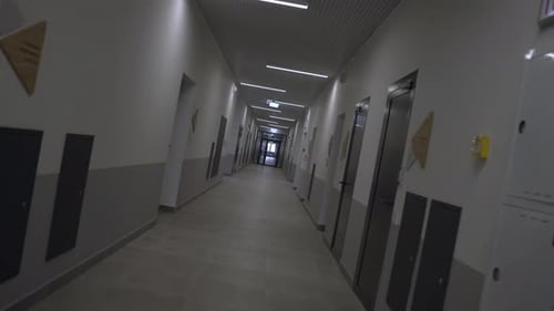Long Empty Corridor with Office Doors and Nameplates