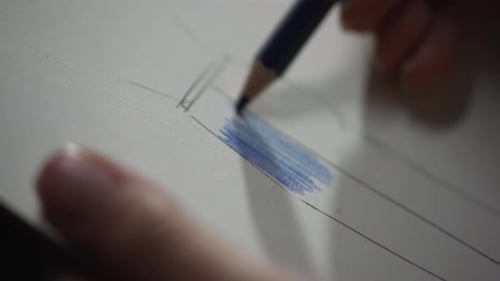Close Up Blue Pencil Drawing on Paper