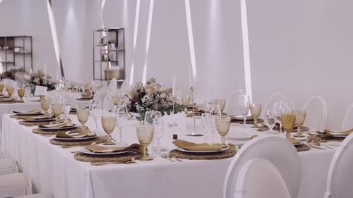 Elegant Wedding Reception Table Setting with Floral Arrangement