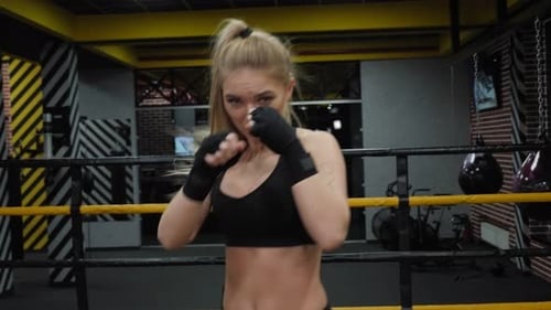Woman Boxing in Gym Ring