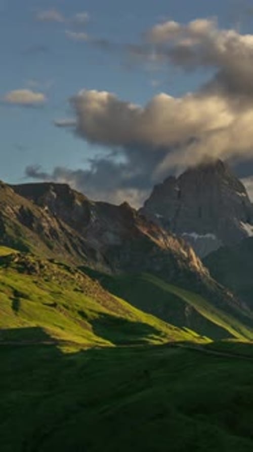 Mountainous Landscape with Partly Cloudy Sky Vertical Panorama