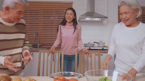 Three Family Members Preparing a Meal Together