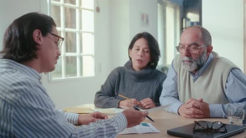 Couple Meeting with Advisor in Bright Home