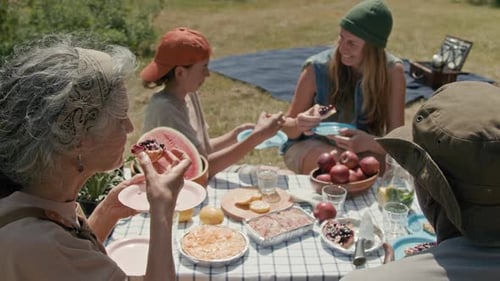 Diverse Neighbors Enjoying Picnic in Community Park
