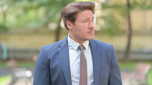 Businessman Waiting, Checking Watch Outdoors in Daytime