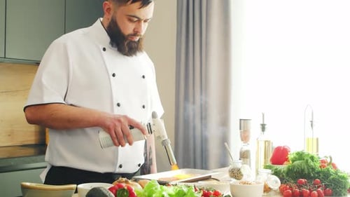 Chef Torch Cooking Food Preparation in Kitchen