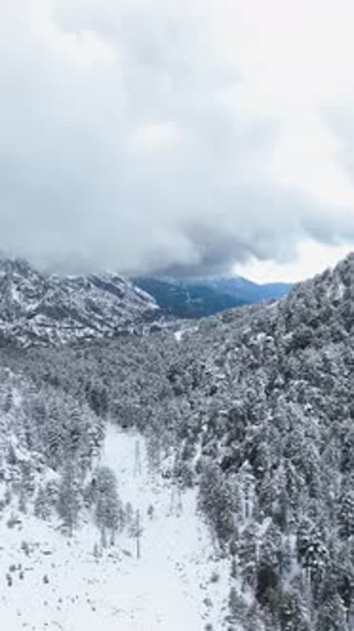 Vertical Video Skyhigh View of Winter Scenery Snowy Valleys