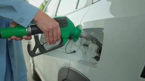 Unrecognizable Woman Driver Vehicle Owner Girl Female Hands Fuel Nozzle in Automobile Tank Filling