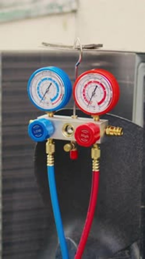 Vertical Video Close Up of Refrigerant Manifold Gauges