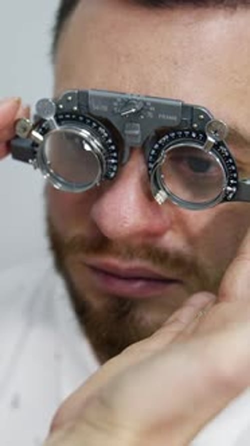 Man Getting Eye Exam with Phoropter Close Up