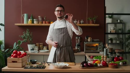 Chef Cutting Ripe Green Avocado in Kitchen