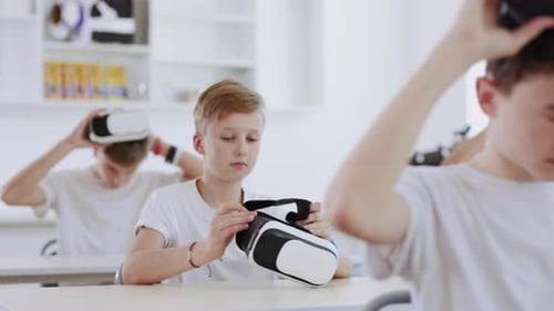Students in classroom using virtual reality headsets