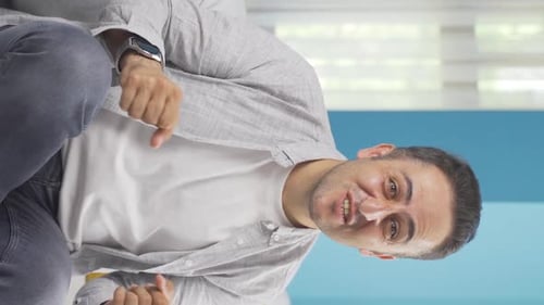 Vertical video of Excited man.