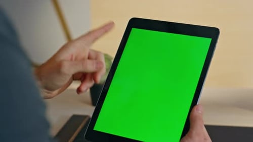Hands Hold Tablet with Green Screen Indoors