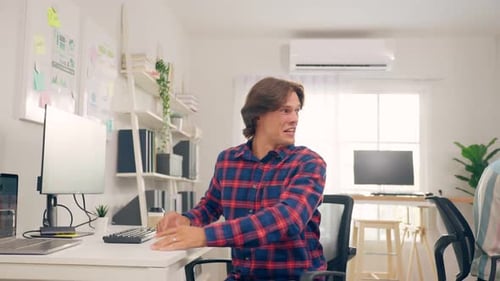 Colleagues Celebrating Teamwork Success in Office