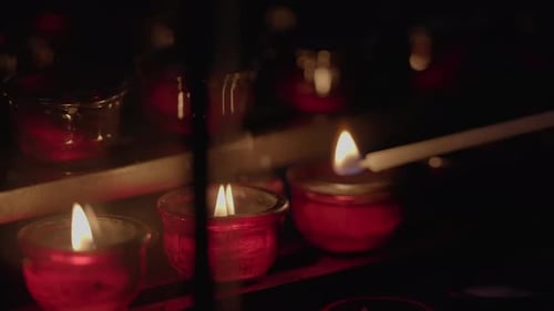 Candle Lighting with White Taper in the Dark