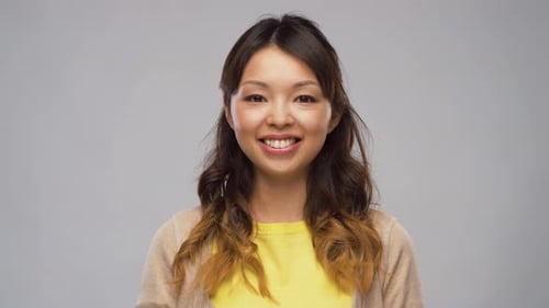 Smiling Woman with Yellow Shirt Posing