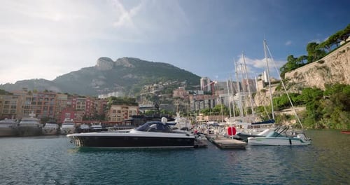 Scenic View Of Yachts In Monaco Marina With Hills In Background