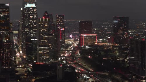 Elevated Unique Perspective of Downtown Los Angeles Cityscape at Night with Illuminated High Rise