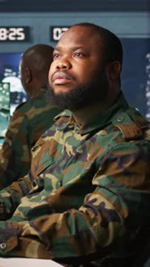 Vertical Video Officer Doing Tasks in Military Base Analyzing Moves