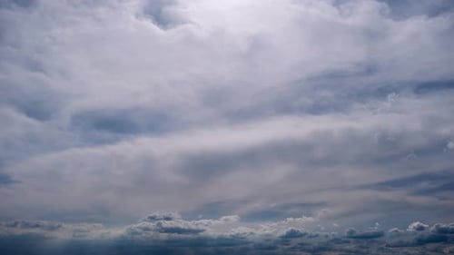 Clouds Moving Slowly Across a Blue Sky