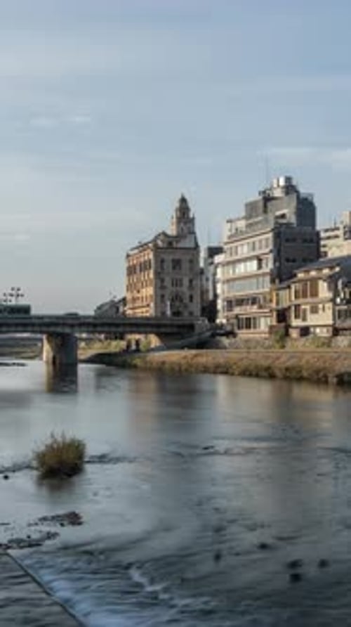 Cityscape skyline vertical time lapse video at Kamo river in a morning, Kyoto city, Japan.