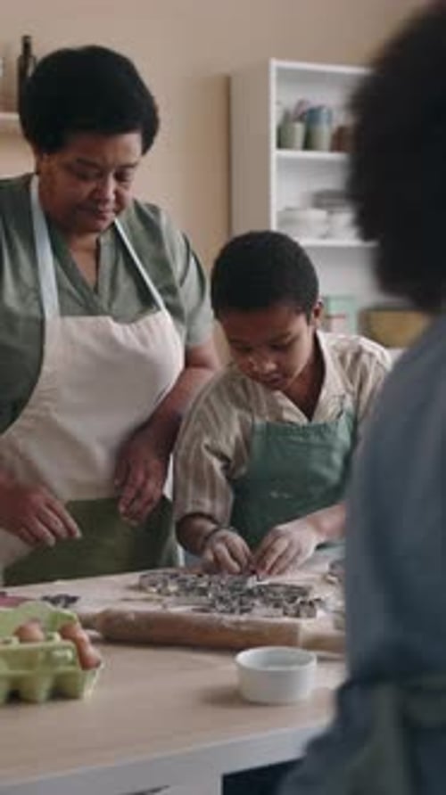 Family fun baking cookies in home kitchen