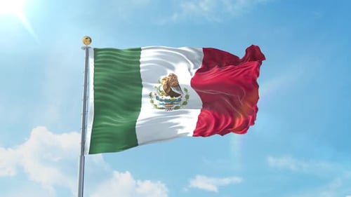 Mexican National Flag Waving in Blue Sky