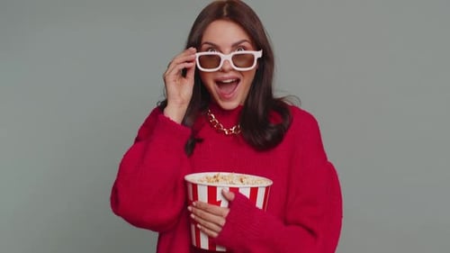 Excited Woman Watching Movie with Popcorn