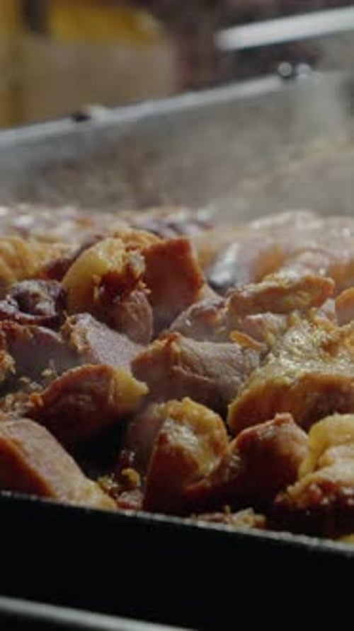 Meat and Sausage Grilling Close Up in Vertical Format