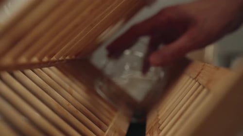 Glass Placed in Light Wood Dish Rack