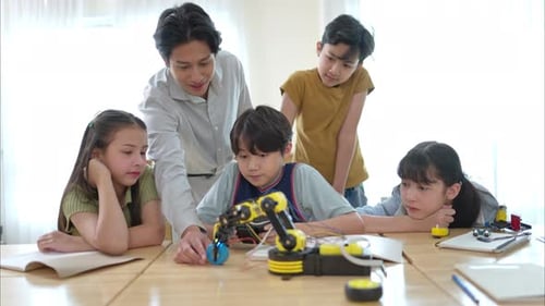 STEM Class, Teacher and students in basic engineering classroom