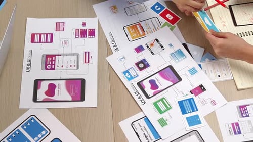 User Experience Designers Collaborating on a Mobile Application