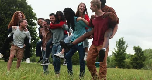Young Multiracial Friends Having Fun Outdoor Laughing Together at City Park African