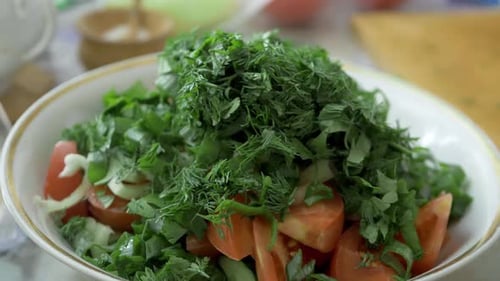 Sliced Tomatoes Cucumbers and Sweet Peppers Topped with Crisp Green