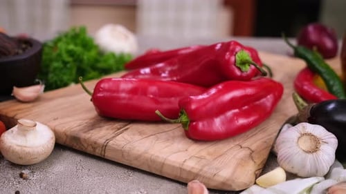 Red Pepper on Wooden Cutting Board at Domestic Kitchen