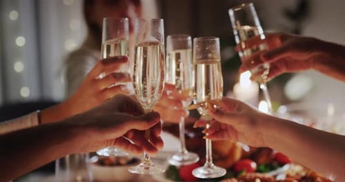 Friends and Family Toast Champagne at Festive Dinner
