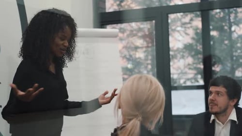 Black Business Woman Leader Speaker Gives Educational Lectures to Employees in a Modern Office