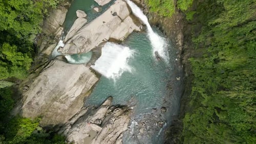 Experience the beauty of nature with this stunning drone video featuring two breathtaking waterfalls