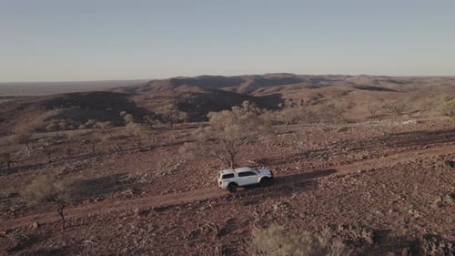 Exploring the rugged hills in the Outback Australia in a four-wheel-drive