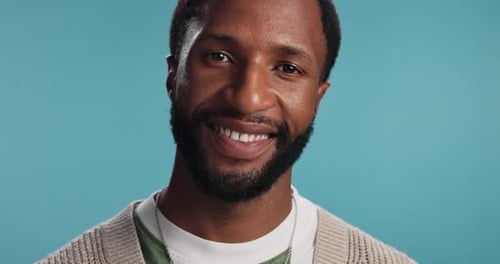 Smile, laughing and face of black man in studio for meme, fashion and confidence