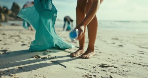Beach, recycle and volunteer with plastic bottle for cleaning, pollution