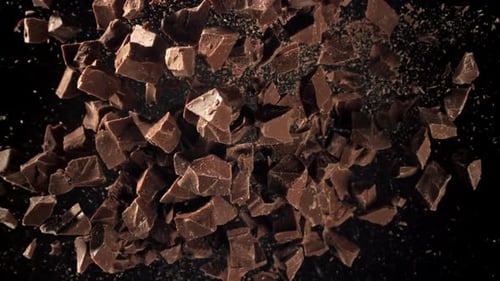Delicious Chunks of Dark Chocolate on Black Background