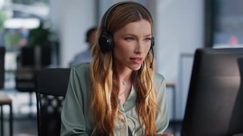 Support Specialist Talking Headset Working Computer at Helpdesk Space Closeup