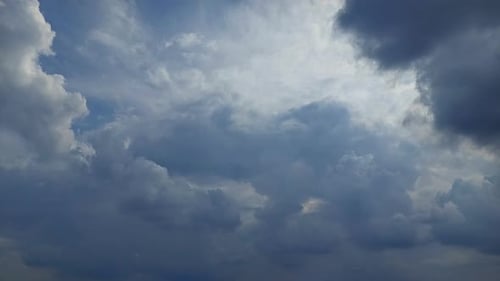 Storm clouds coming - 4k time-lapse footage, billowing dark clouds on the sky