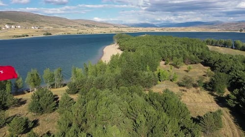 Turkish Flag Waving Over Beautiful Lake and Forest